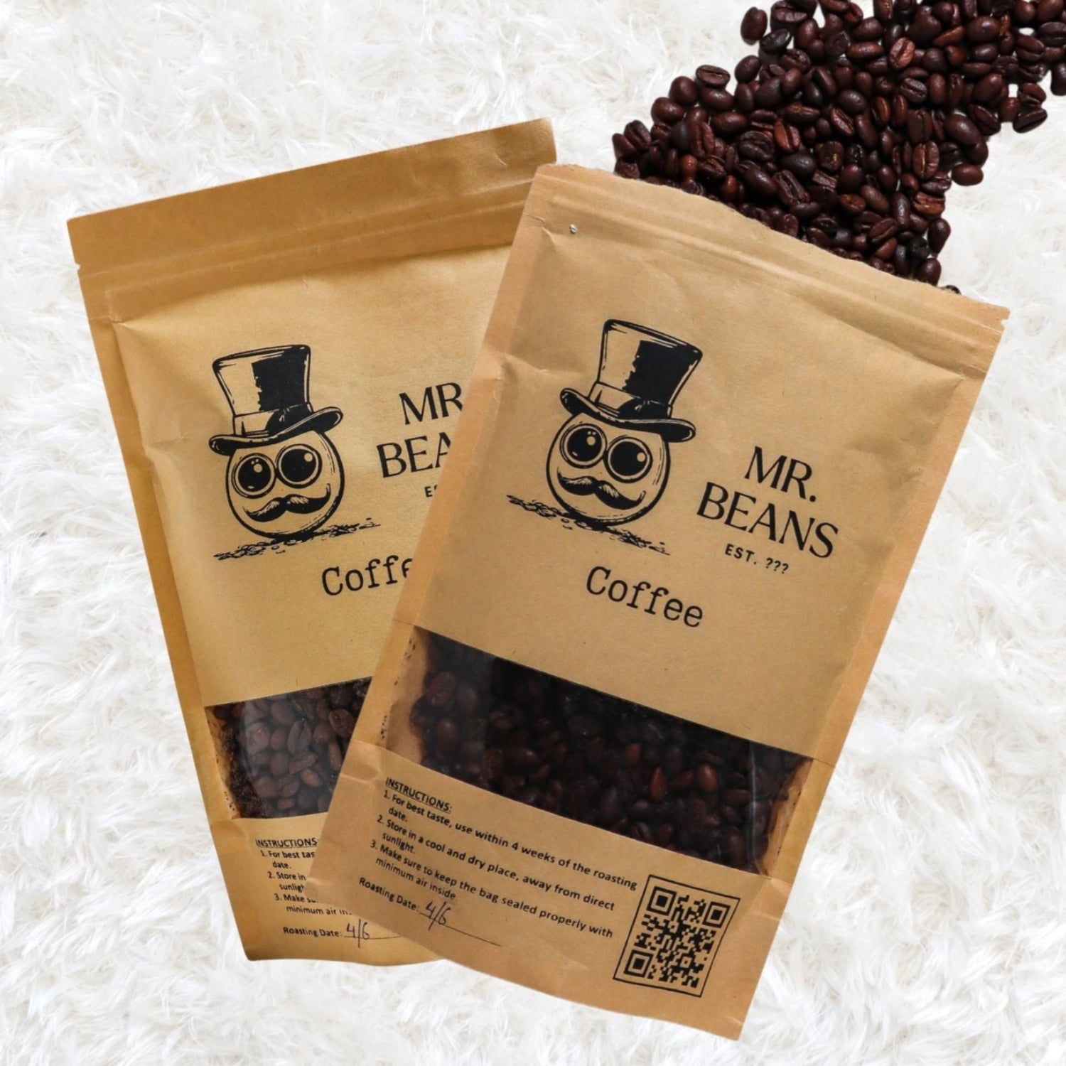 Two brown paper bags of Mr. Beans Coffee with coffee beans on a white background